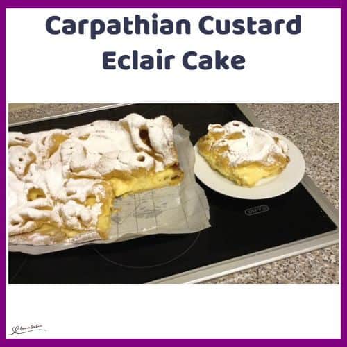 an image of a rustic Carpathian Custard Eclair Cake dusted with icing sugar