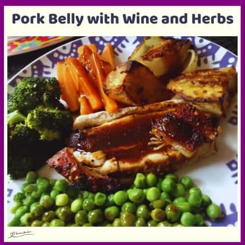 An image of Pork Belly with Wine and Herbs with broccoli, green peas and carrots