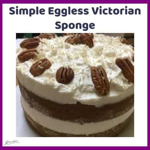 an image of a double layer Simple Eggless Victorian Sponge with cream and nuts
