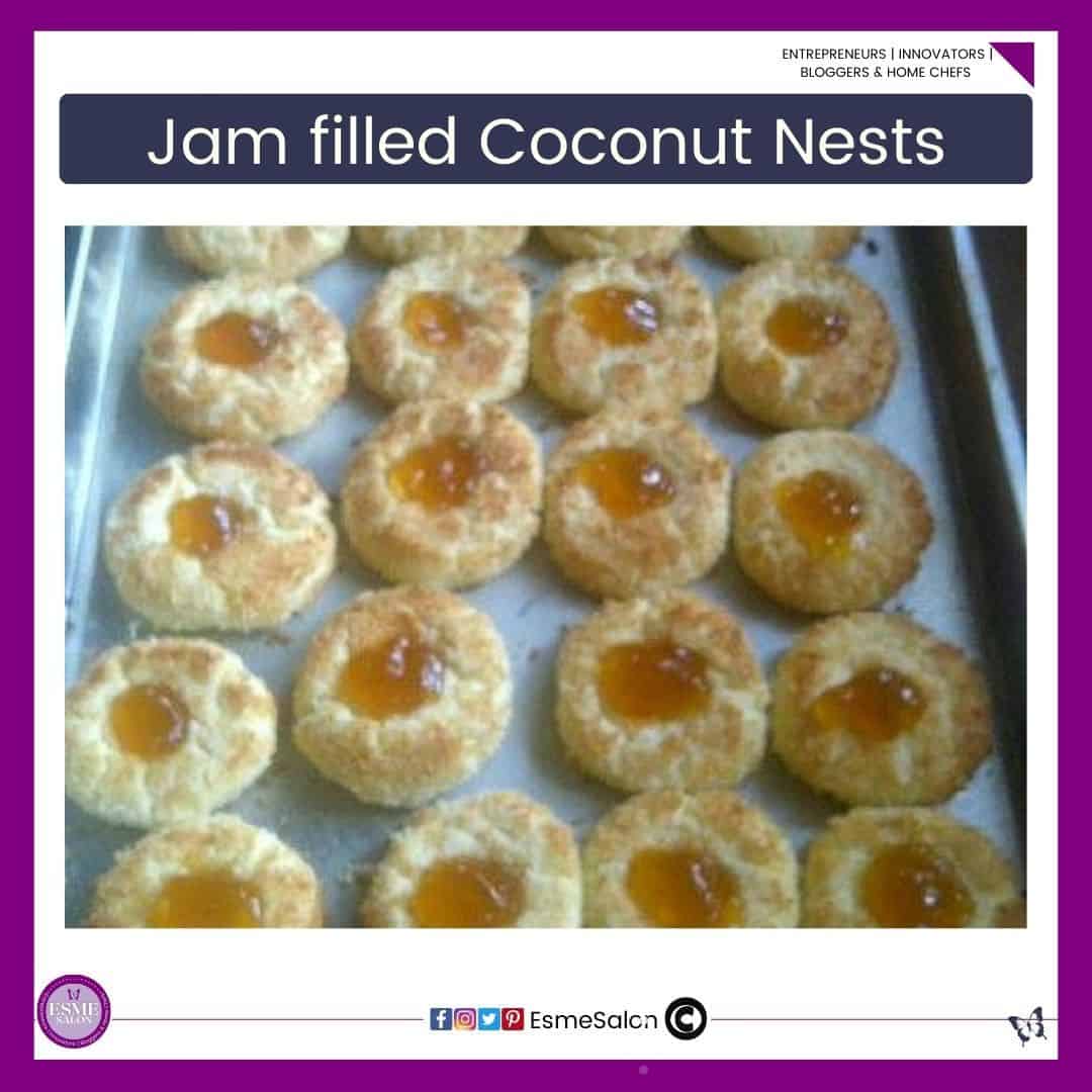 an image of a baking tray with parchment paper filled with already baked Coconut nests with Jam in the middle