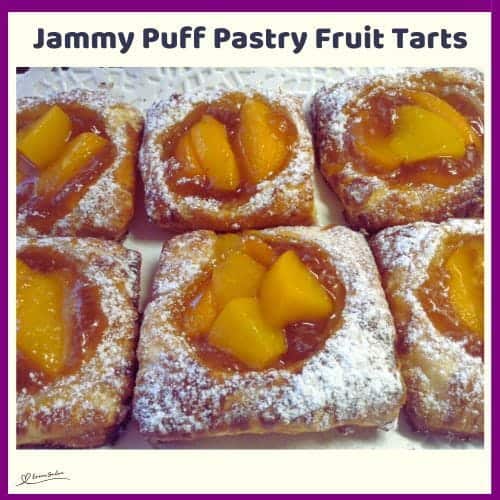 An image of Jammy Puff Pastry Fruit Tarts dusted with Icing sugar