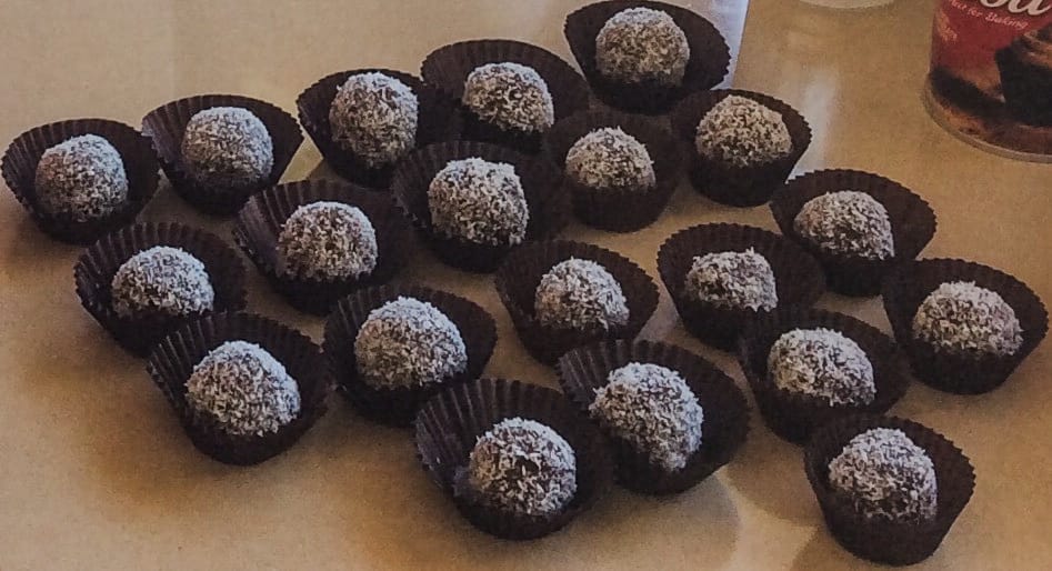 Chocolate Bliss Balls in brown paper cupcake holders