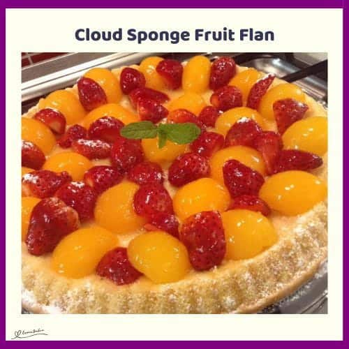 An image of a Cloud Sponge Fruit Flan with peaches and strawberries
