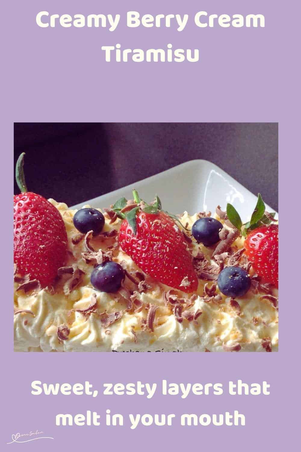 An image of a Berry Cream Tiramisu with boudoir biscuits and topped with blue and strawberries