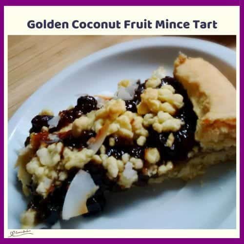 An image of a slice of Golden Coconut Fruit Mince Tart