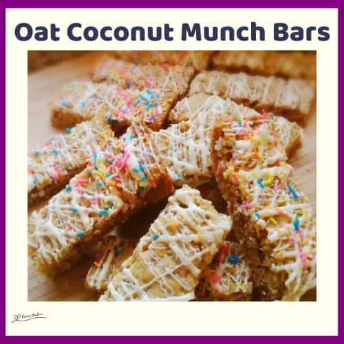 An image of a stack of Oat Coconut Munch Bars drizzled with white chocolate