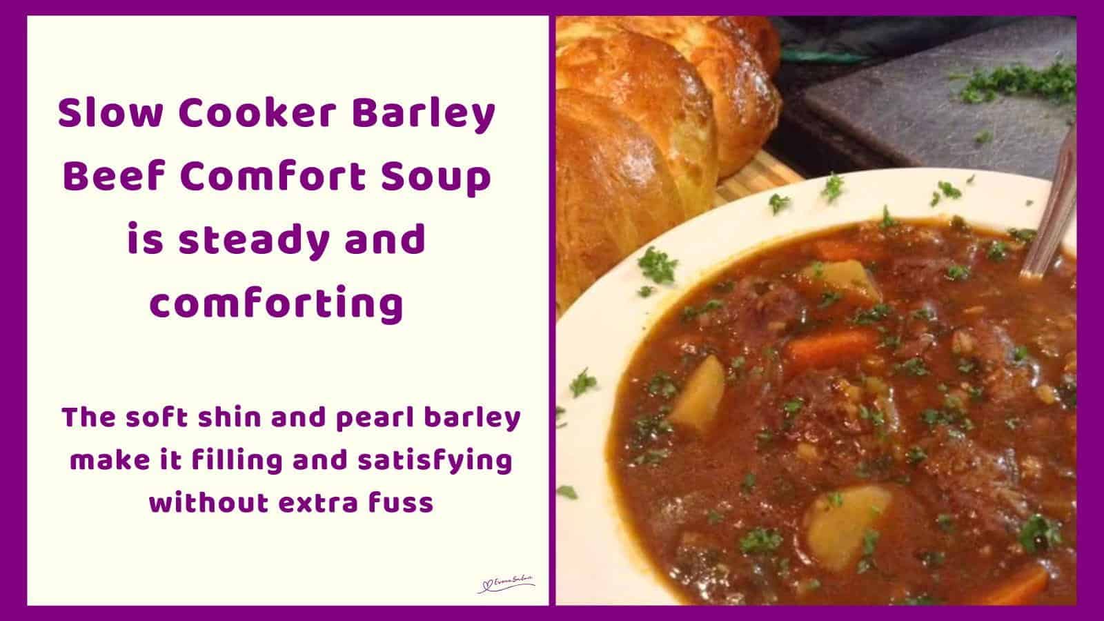 An image of a bowl of Slow Cooker Barley Beef Comfort Soup with fresh bread on the side