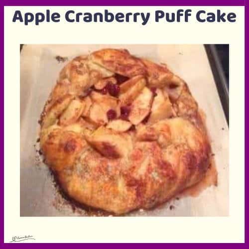 An image of an Apple Cranberry Puff Cake with cranberries