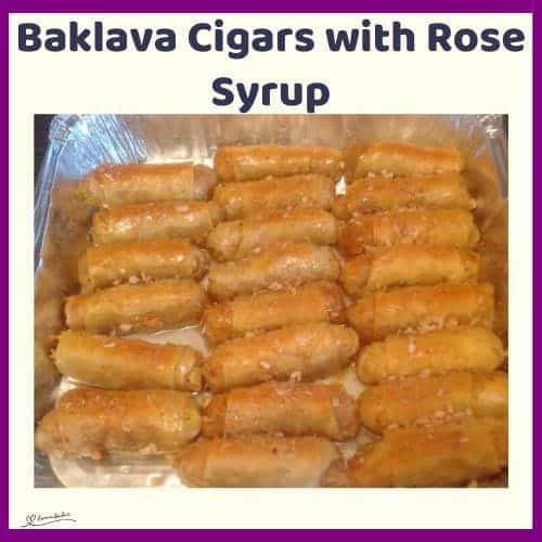 An image of Baklava Cigars with Rose Syrup in a tinfoil pan
