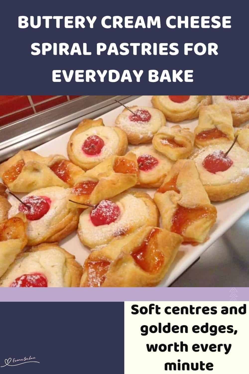 An image of a batch of Cream Cheese Spiral Pastries dotted with cherries or jam