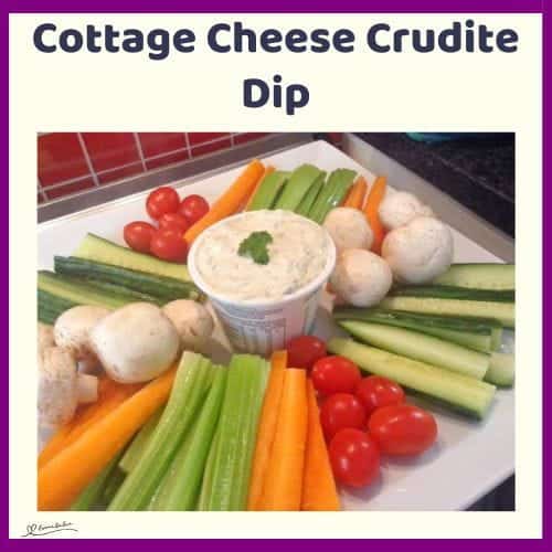 An image of a tub of Cottage Cheese Crudite Dip with fresh veggies arranged around it