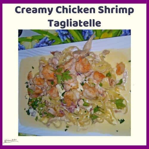 An image of a white platter with Creamy Chicken Shrimp Tagliatelle