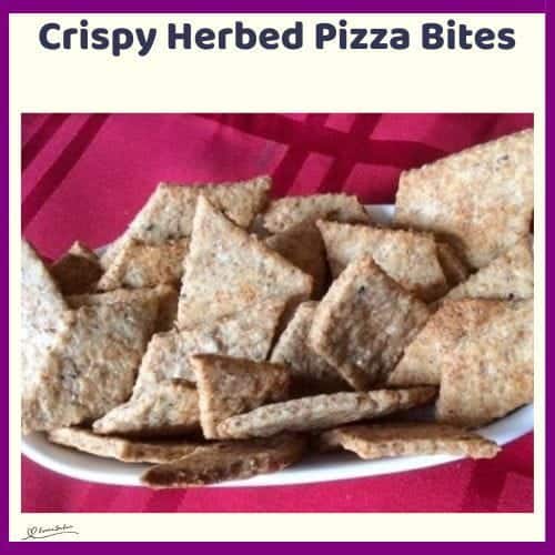 An image of Crispy Herbed Pizza Bites in a white platter on a red backing