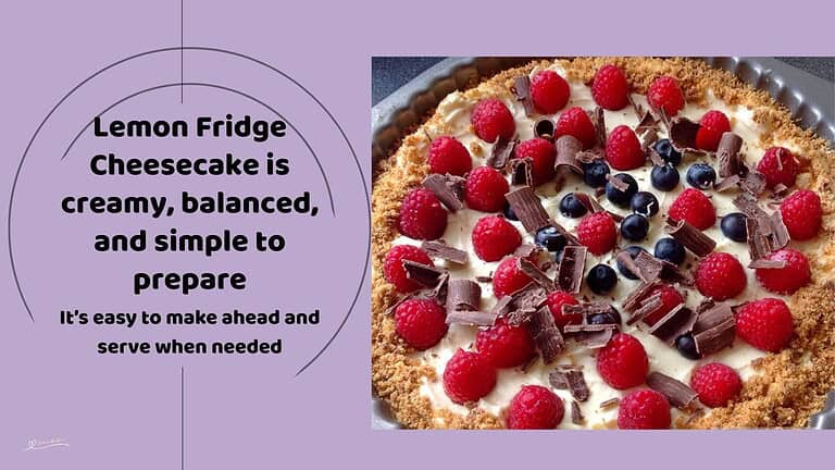 An image of a Lemon Fridge Cheesecake decorated with berries and chocolate shavings