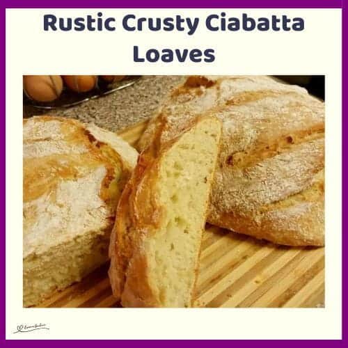 An image of 2 Rustic Crusty Ciabatta Loaves on a wooden cutting board