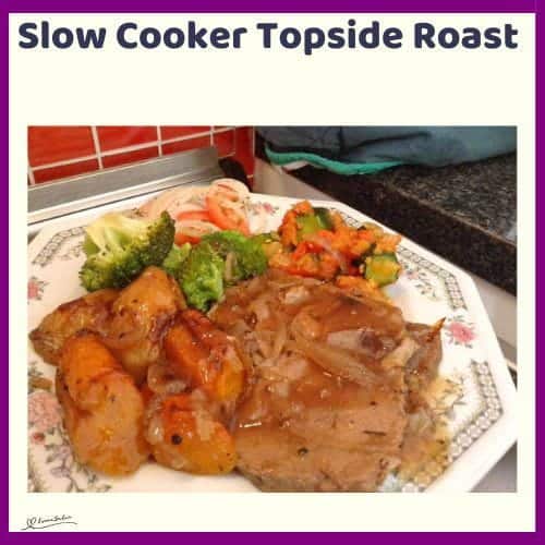 An image of Slow Cooker Topside Roast plated, with veggies and a side of salad