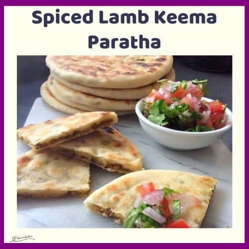 An image of flatbread, Spiced Lamb Keema Paratha on a white platter