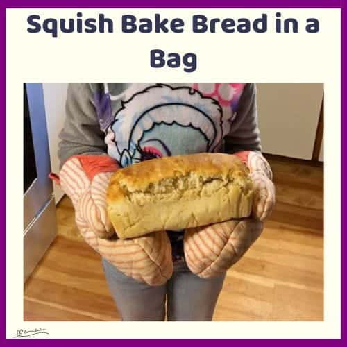An image of a young girl standing with a Squish Bake Bread in a Bag in her hands, fresh out of the oven