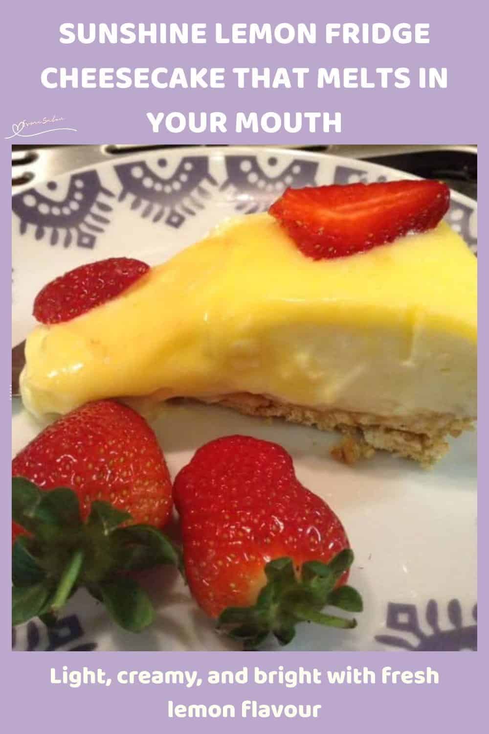 An image of a Sunshine Lemon Fridge Cheesecake decorated with fresh strawberries