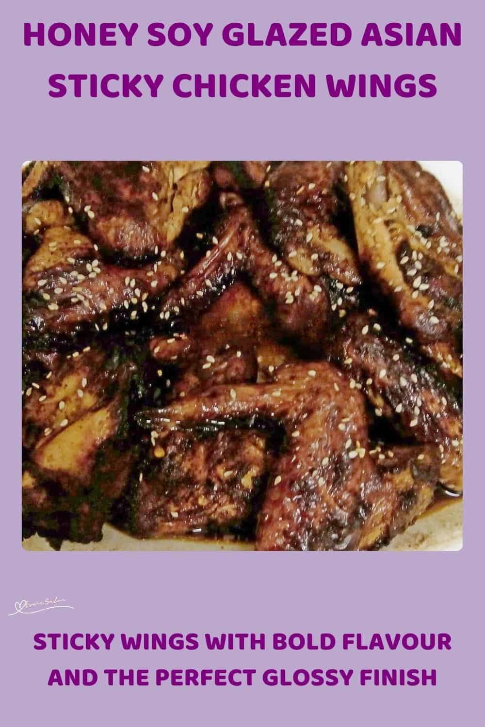 An image of a plate filled with Asian Sticky Chicken Wings sprinkled with sesame seed