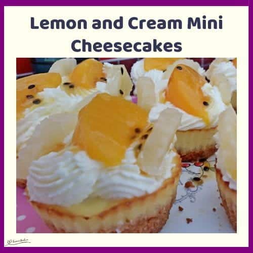An image of Lemon and Cream Mini Cheesecakes decorated with cream and fresh fruit