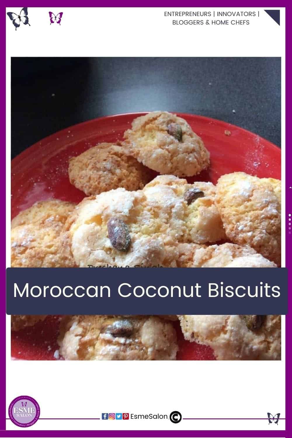 an image of a red plate filled with Moroccan Coconut Biscuits and dusted with icing sugar