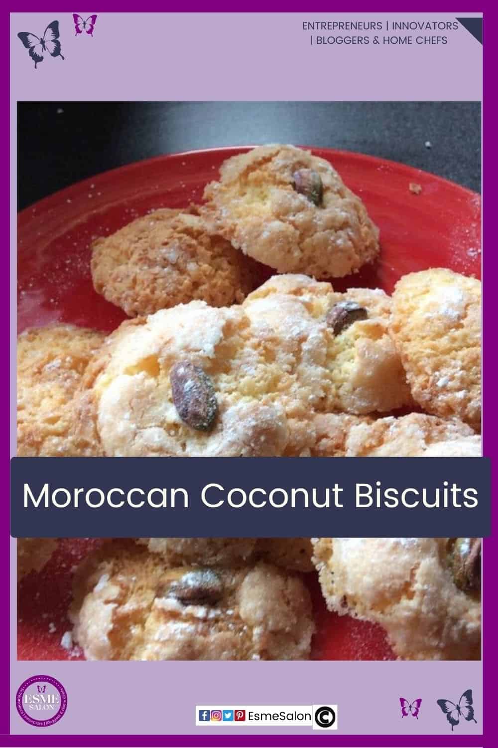 an image of a red plate filled with Moroccan Coconut Biscuits and dusted with icing sugar