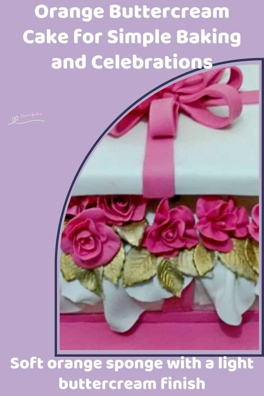 An image of an orange buttercream cake in the shape of a gift with a pink bow and pink roses between the layers