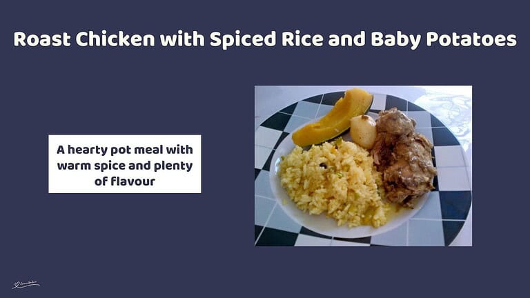 An image of a plate of Roast Chicken with Spiced Rice with a side of veggies