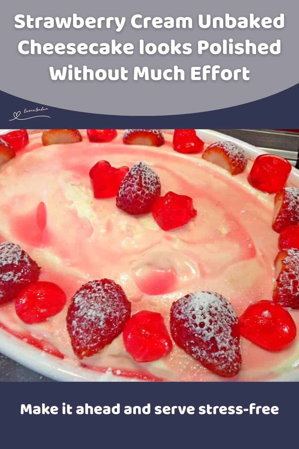 An image of a bowl filled with a Strawberry Cream Unbaked Cheesecake and decorated with strawberry jellie and fresh strawberries