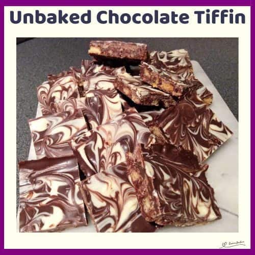 An image of a tray with Unbaked Chocolate Tiffin cubes