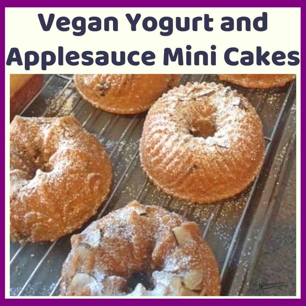 An image of Small Bundt Vegan Yogurt Applesauce Cakes with almonds and dusting of icing sugar