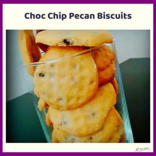 An image of Choc Chip Pecan Biscuits stacked in a glass