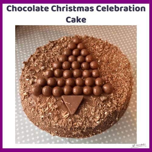 An image of a round chocolate cake with Ganache, Malteser Balls and Toblerone as decoration