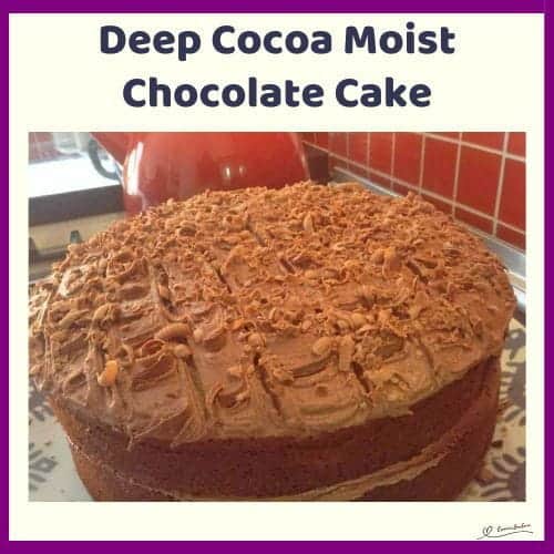 An image of a double-layer Chocolate Cake with Chocolate Buttercream Icing and grated milk chocolate