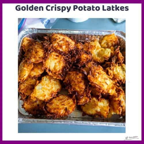 An image of Crispy Potato Latkes in a tinfoil container