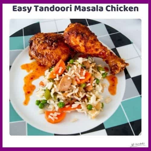 An image of 2 pieces of Tandoori Masala Chicken with colorful veggie rice