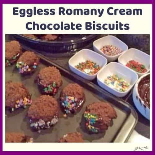 An image of Eggless Romany Cream Biscuits with chocolate filling and dipped in colored sprinkles