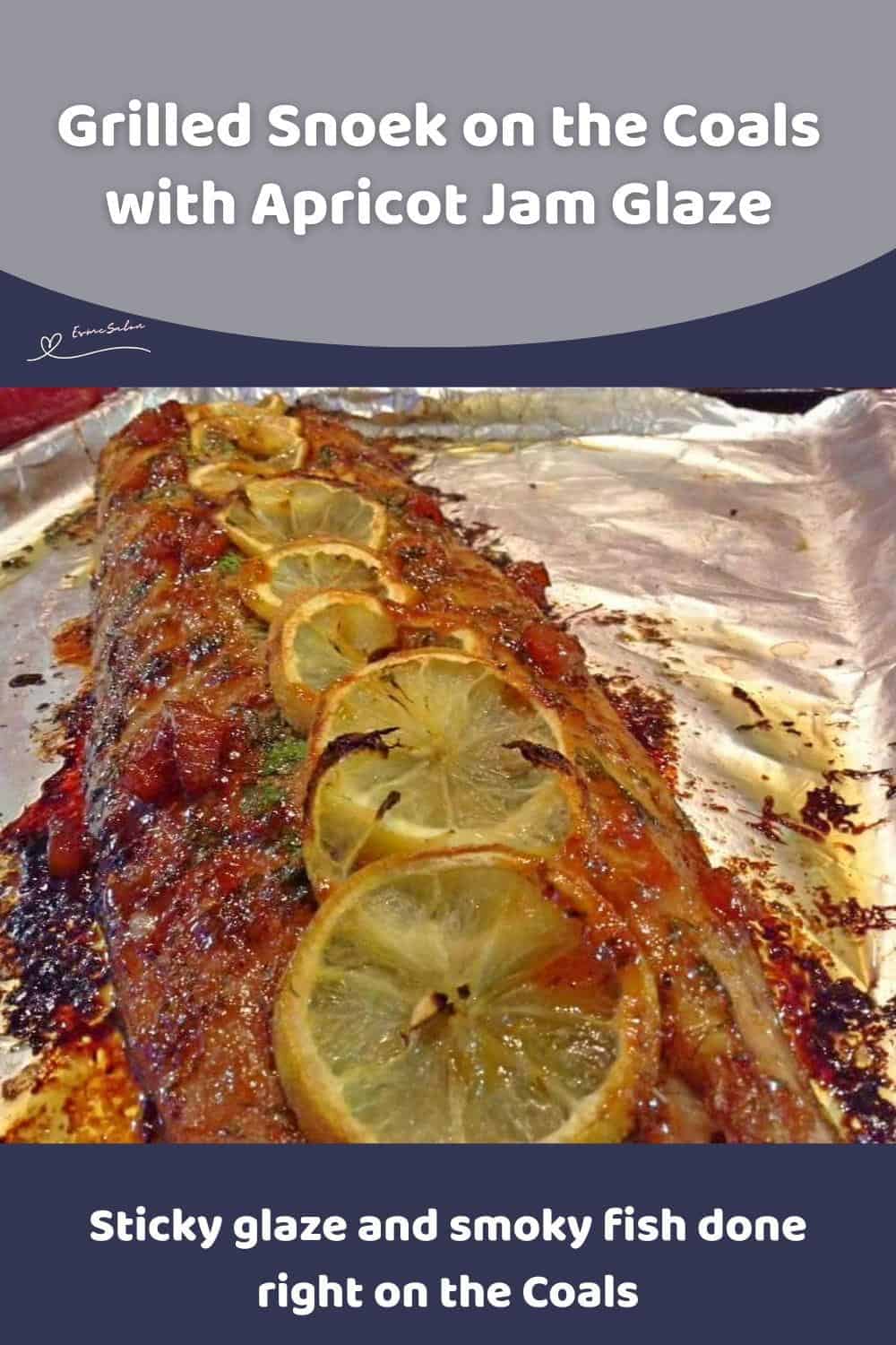 An image of Grilled Snoek basted with apricot jam and topped with slices of lemon on tinfoil prepared on the Coals