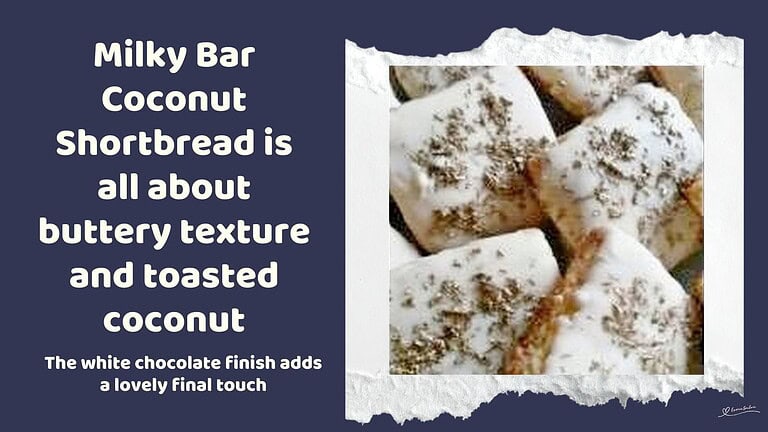 An image of a Classic Milky Bar Coconut Shortbread Biscuit dipped in white chocolate