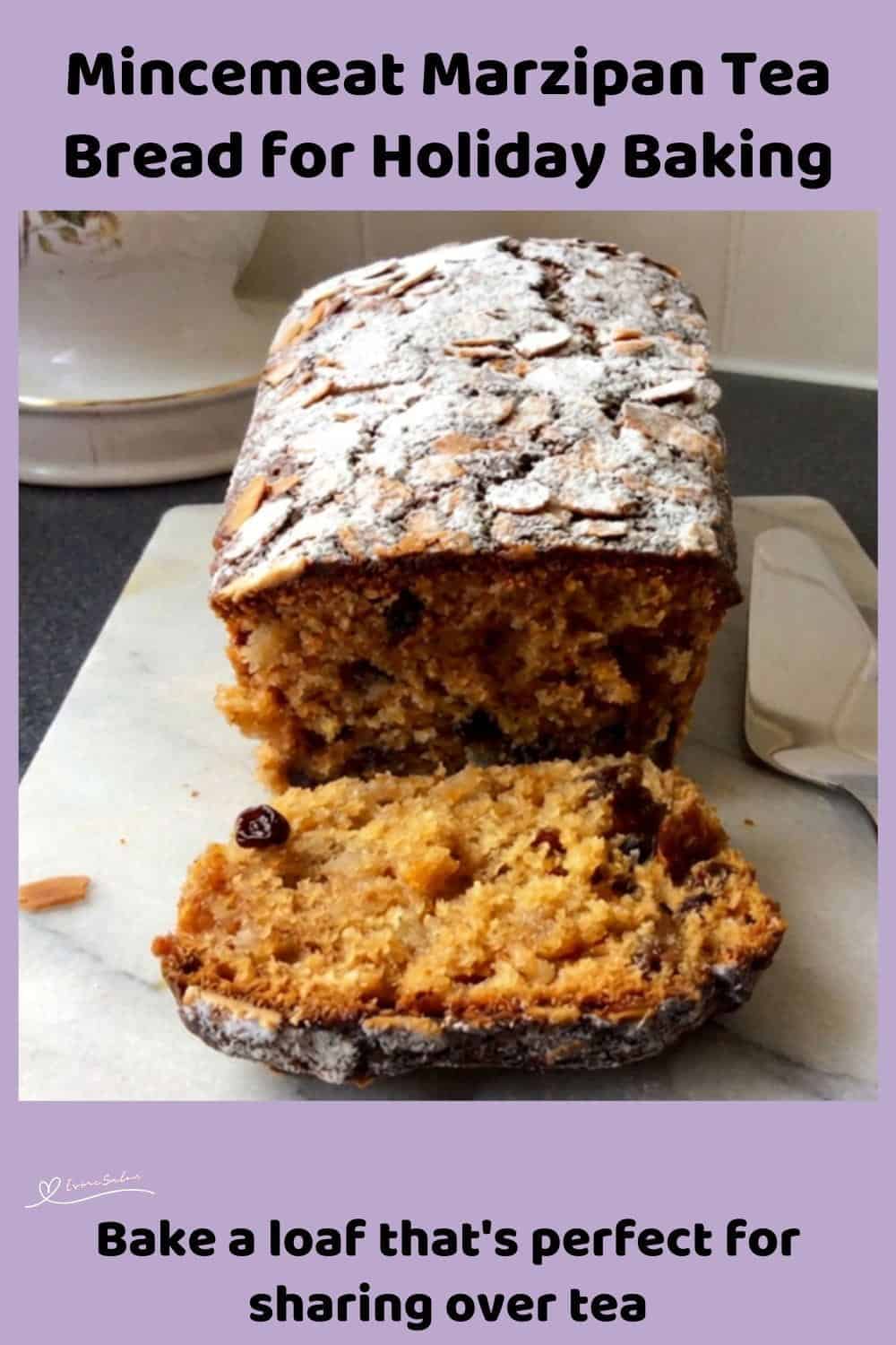 An image of a Mincemeat Marzipan Tea Bread with flaked almonds and dusted with icing sugar