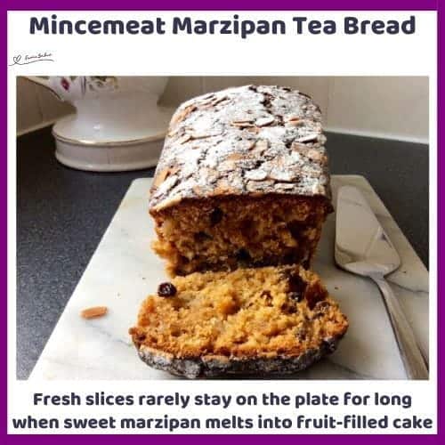 An image of a Mincemeat Marzipan Tea Bread with flaked almonds and dusted with icing sugar