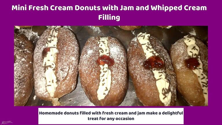 An image of Mini Fresh Cream Donuts with Jam and Whipped Cream Filling and a dollop of jam