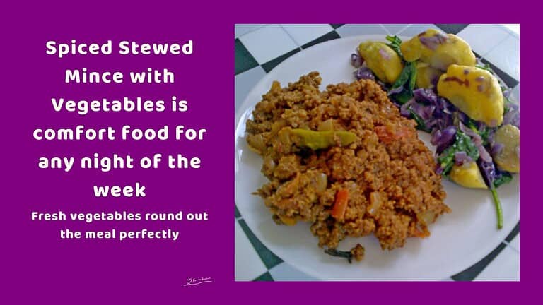 An image of a plate with Spiced Stewed Mince with potatoes and red cabbage