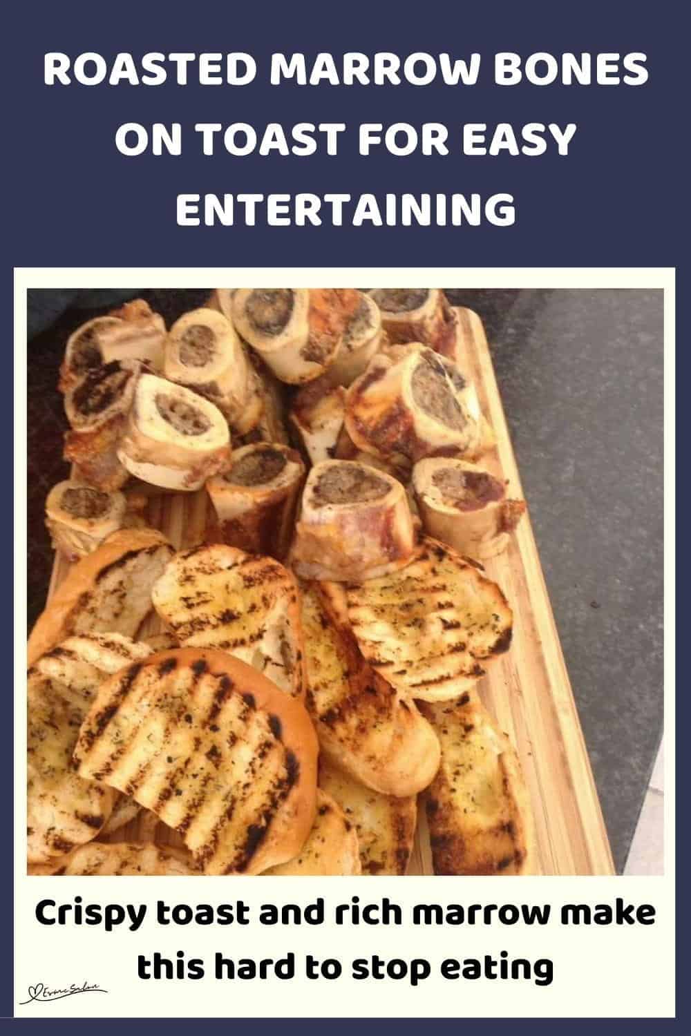 An image of a wooden board filled with Roasted Marrow Bones and Toast on the side