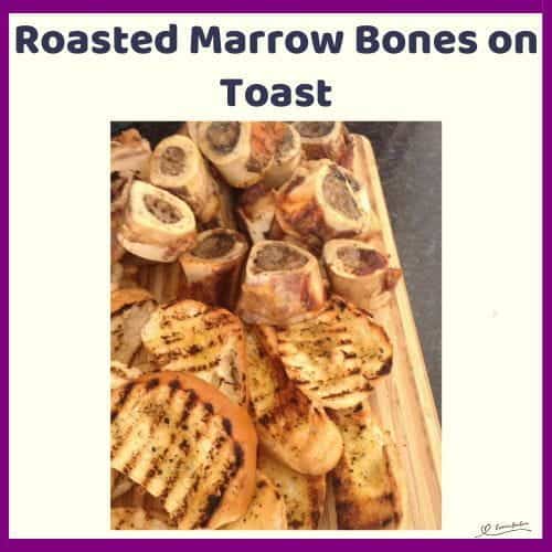 An image of a wooden board filled with Roasted Marrow Bones and Toast on the side
