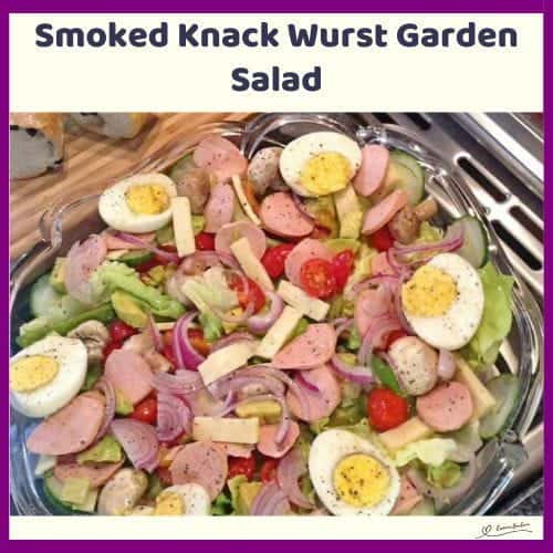 An image of a plate with Smoked Knack Wurst Garden Salad, with Creamy Avocado and Emmenthal Cheese