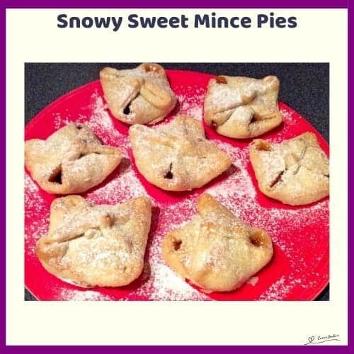 An image of Sweet Mince Pies dusted with icing sugar or a red plate