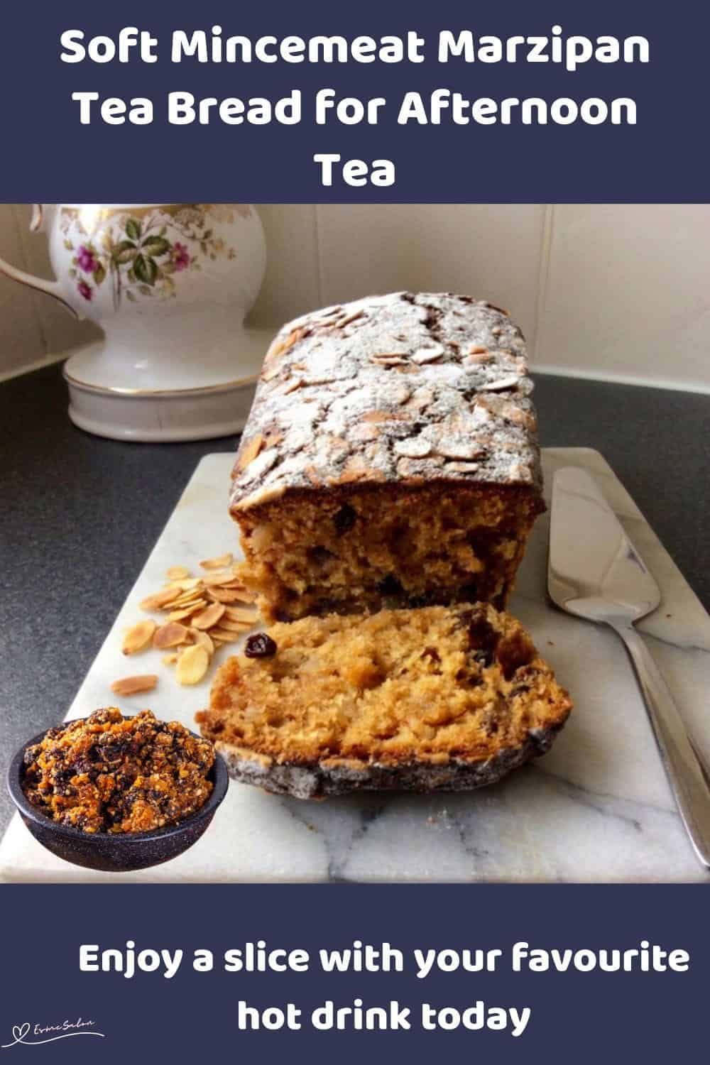 An image of a Mincemeat Marzipan Tea Bread with flaked almonds and dusted with icing sugar