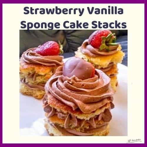An image of Strawberry Vanilla Sponge Cake Stacks with chocolate icing and decorated with fresh strawberries